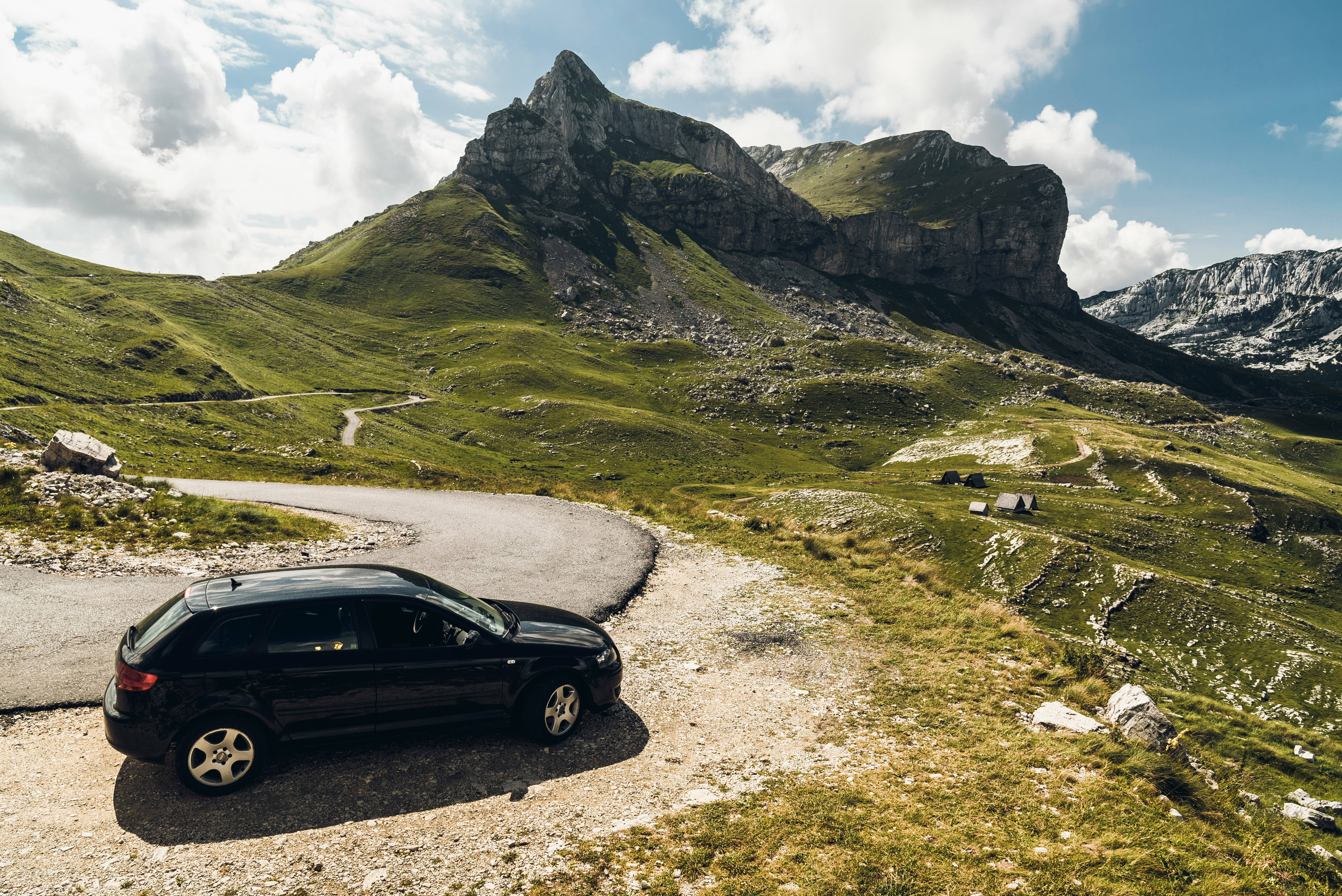 black 5-door hatchback near mountains